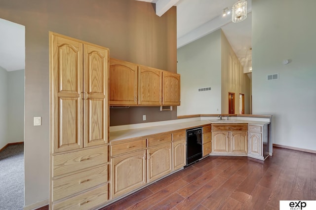 kitchen featuring dishwasher, light brown cabinets, beamed ceiling, decorative light fixtures, and kitchen peninsula