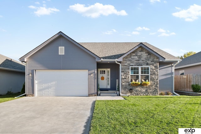 view of front facade featuring a front yard and a garage