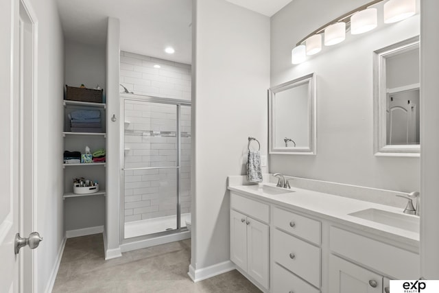 bathroom with vanity, toilet, and a shower with shower door