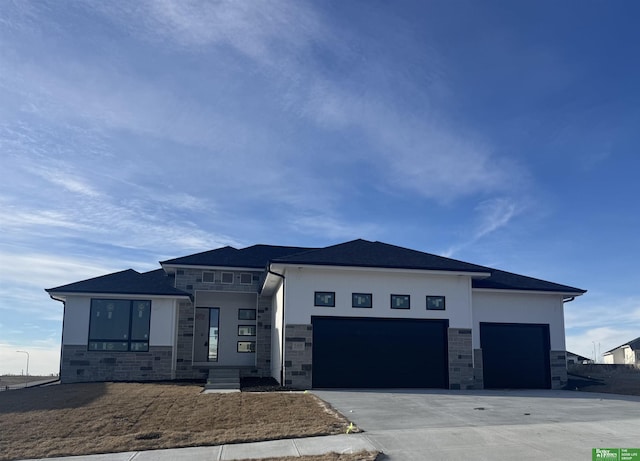 prairie-style home featuring a garage