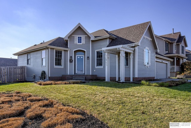 view of front of home featuring a front yard and a garage