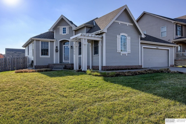 view of front facade featuring a pergola, a front yard, and a garage