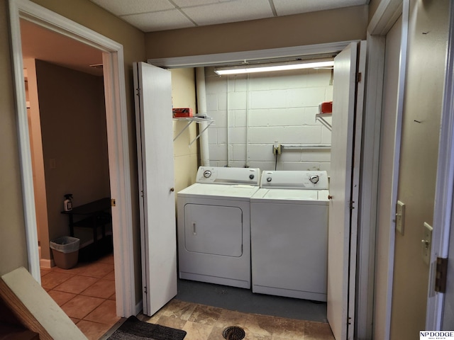 clothes washing area featuring washer and dryer