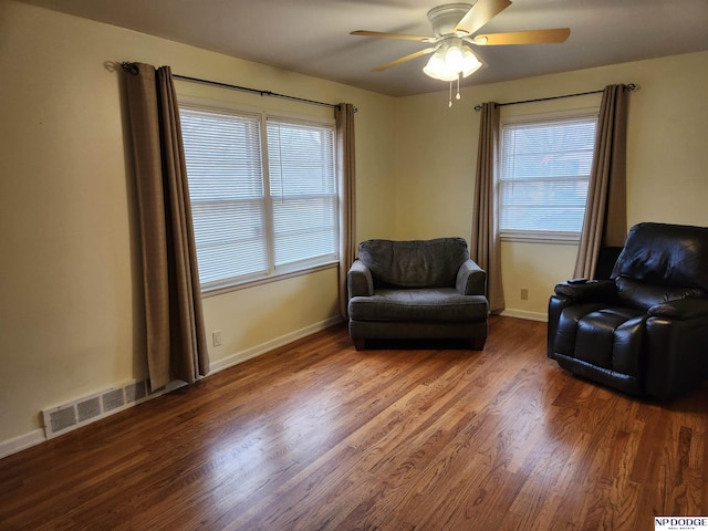 sitting room featuring ceiling fan, hardwood / wood-style floors, and plenty of natural light