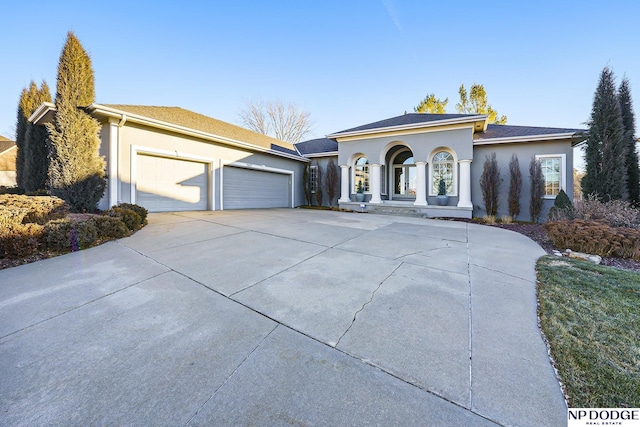 view of front of property featuring a porch and a garage