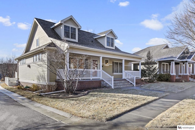 cape cod home with a porch