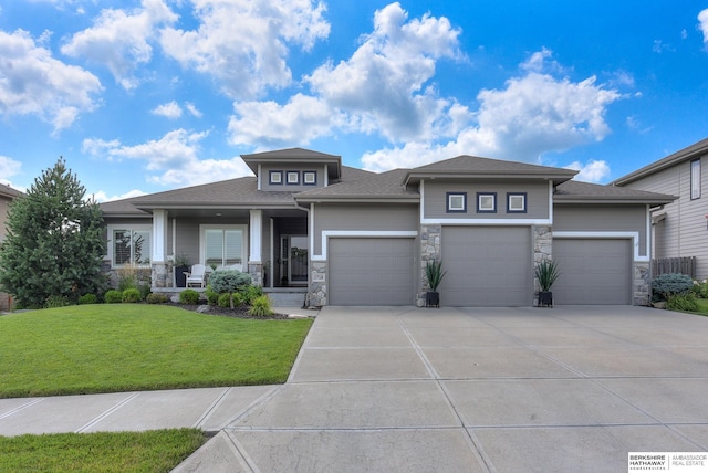 prairie-style house with a front lawn and a garage