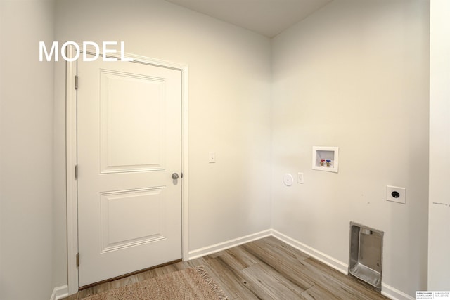 laundry room featuring hookup for an electric dryer, hookup for a washing machine, and hardwood / wood-style flooring