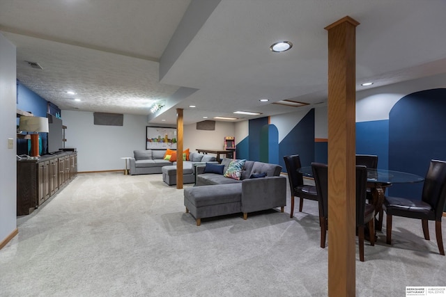 carpeted living room with a textured ceiling