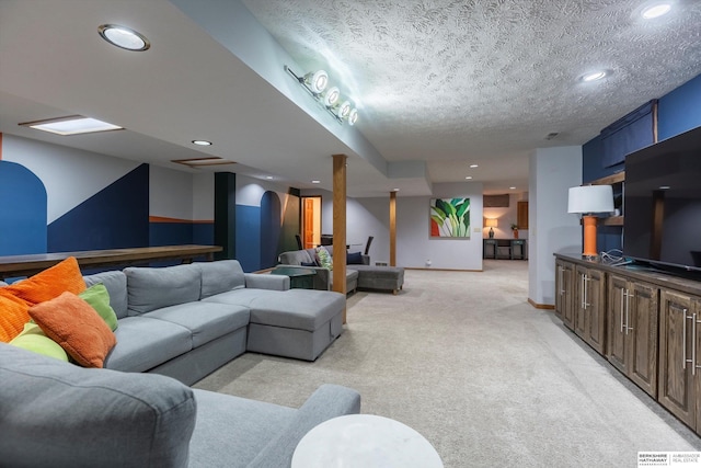 living room featuring light carpet and a textured ceiling