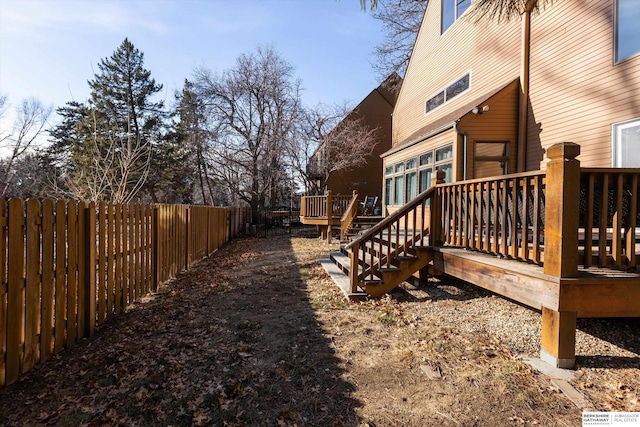 view of yard featuring a wooden deck