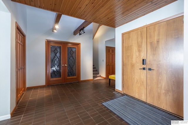 tiled foyer with lofted ceiling with beams, french doors, and wooden ceiling