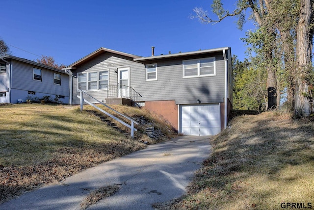 exterior space with a garage and a yard