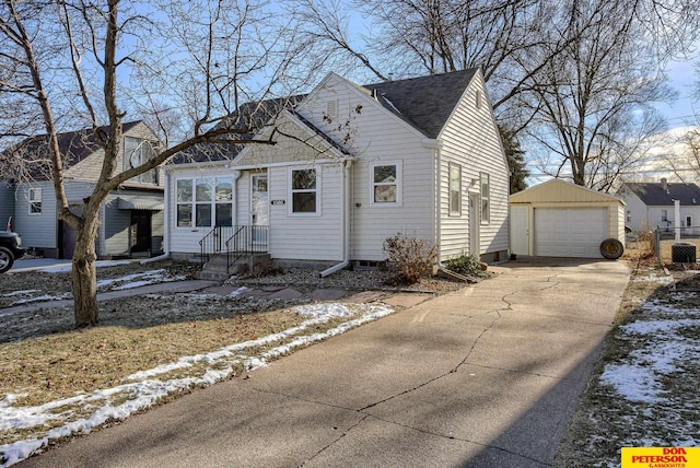 view of front of home with a garage and an outdoor structure