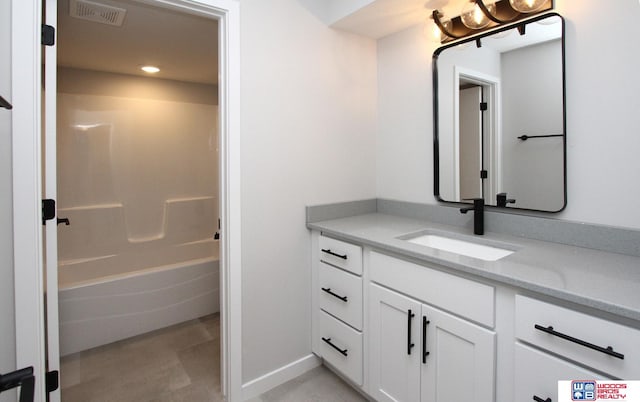 bathroom with shower / bath combination and vanity