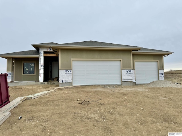 prairie-style home featuring a garage