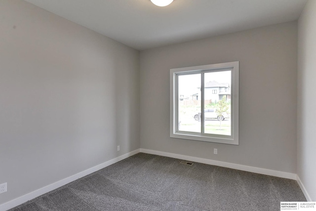 unfurnished room with carpet flooring