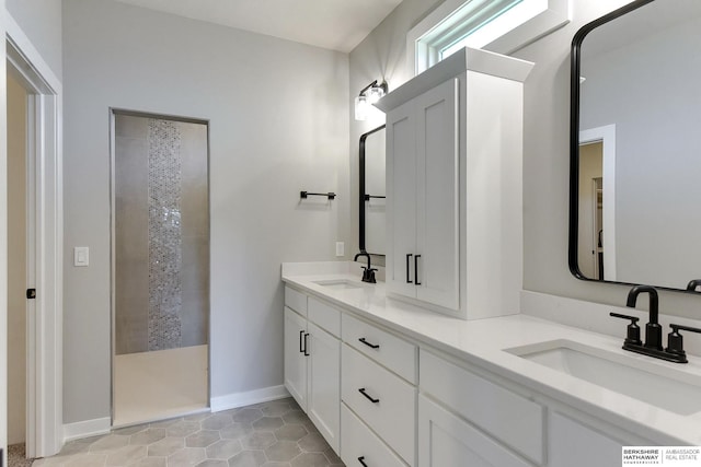 bathroom with vanity, tile patterned floors, and walk in shower