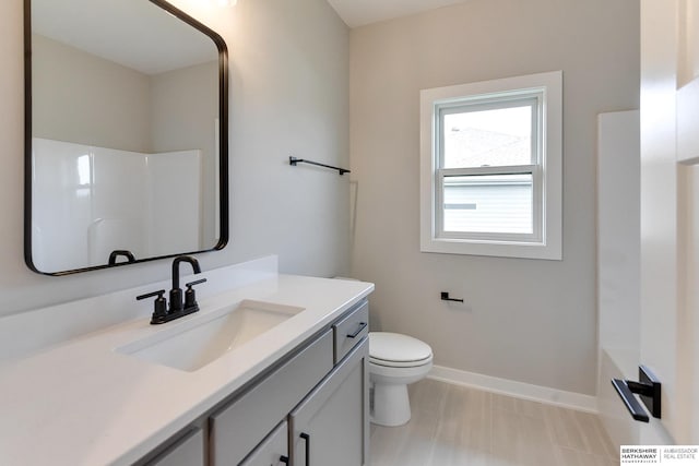 bathroom featuring vanity and toilet