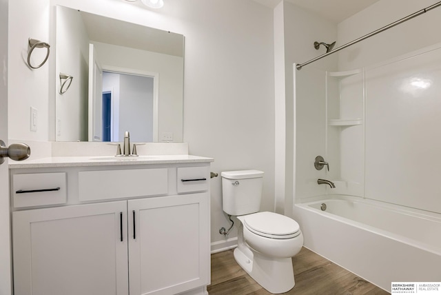 full bath featuring vanity, toilet, wood finished floors, and bathtub / shower combination