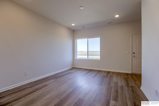 unfurnished room featuring light hardwood / wood-style floors