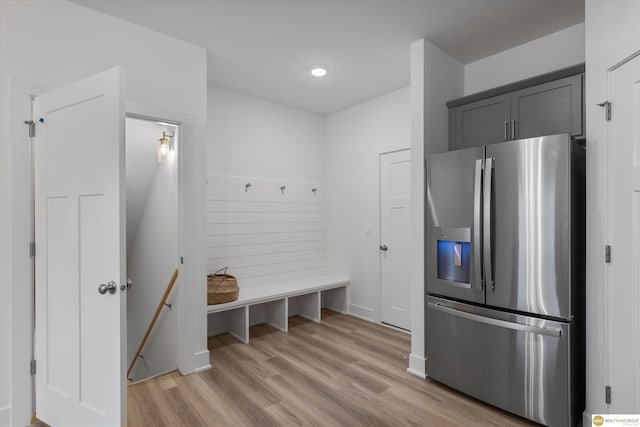 mudroom with light hardwood / wood-style floors