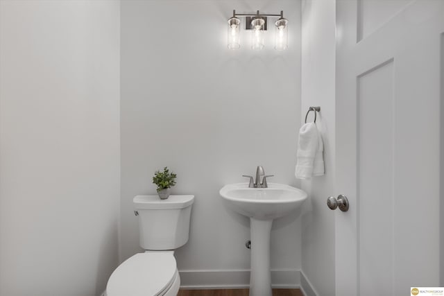 bathroom featuring sink and toilet