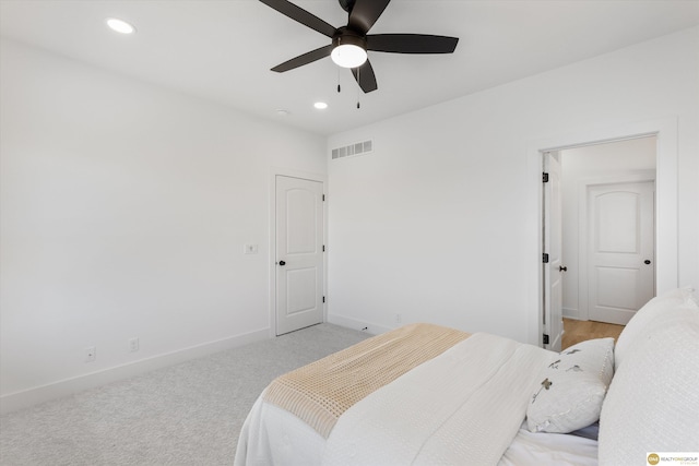 carpeted bedroom with ceiling fan