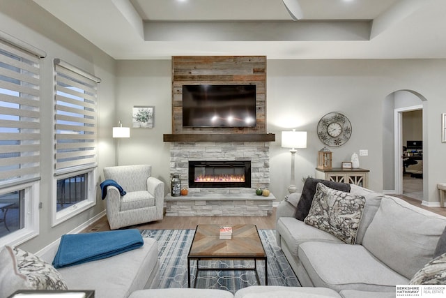 living room with a fireplace and hardwood / wood-style floors