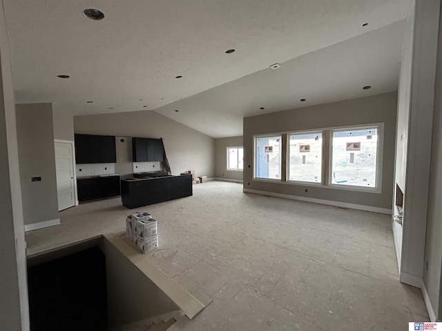 living room featuring vaulted ceiling