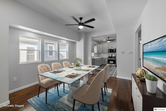 dining space with dark hardwood / wood-style floors, ceiling fan, and sink