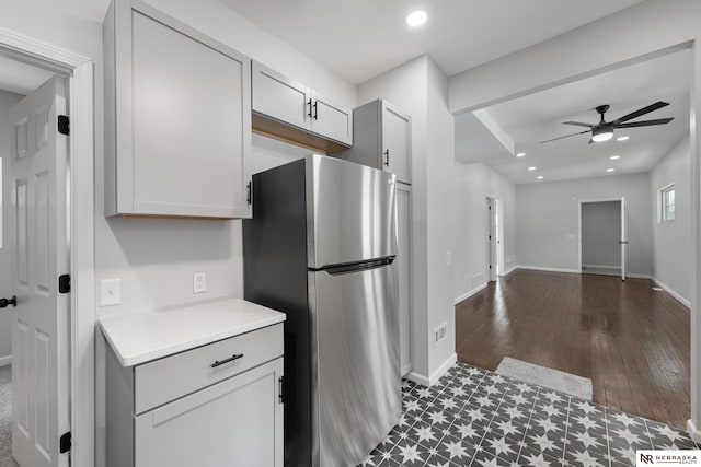 kitchen with ceiling fan and stainless steel fridge