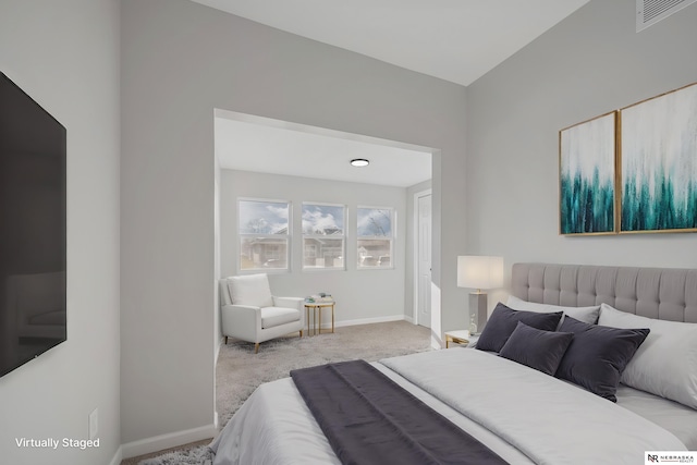 bedroom featuring light colored carpet