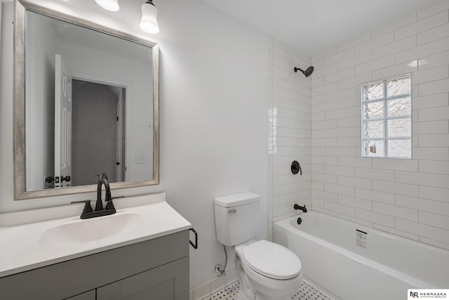 full bathroom featuring vanity, toilet, and tiled shower / bath combo