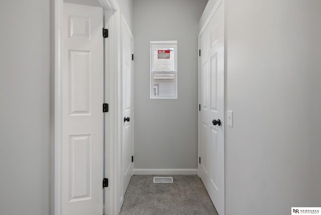 corridor with carpet floors