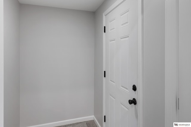 hallway featuring carpet flooring