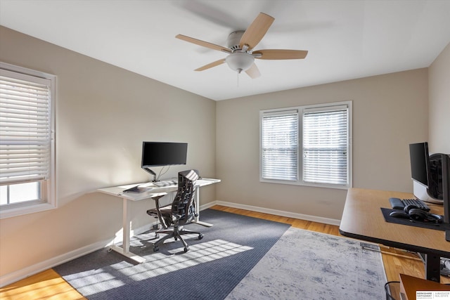 office area with ceiling fan and hardwood / wood-style floors