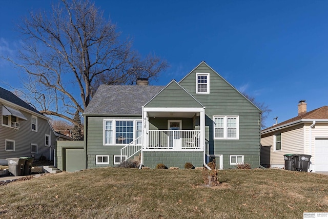 view of front of property with covered porch and a front yard