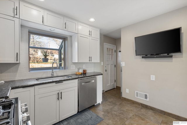 kitchen featuring stainless steel appliances, white cabinets, and sink