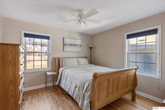 bedroom with ceiling fan and light wood-type flooring