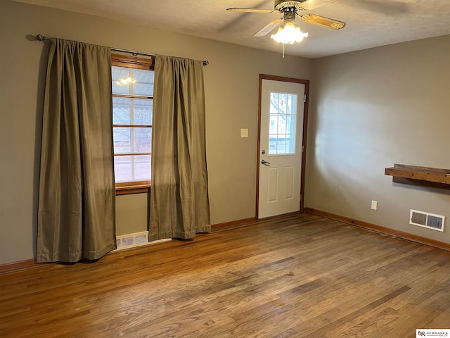 entrance foyer with light hardwood / wood-style flooring and ceiling fan