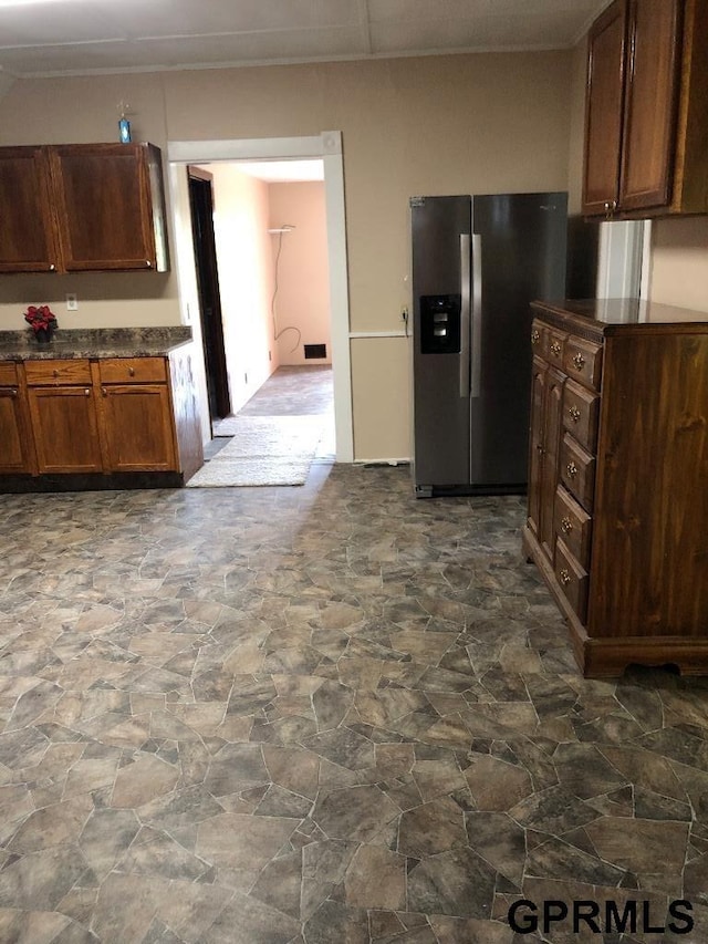 kitchen with stainless steel refrigerator with ice dispenser