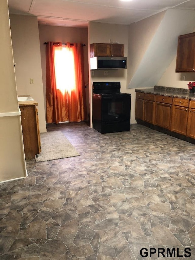 kitchen with black electric range oven