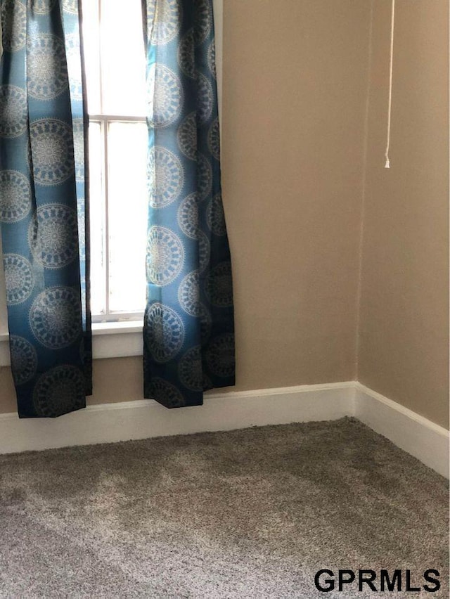 unfurnished room with carpet