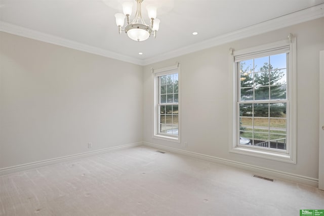 empty room featuring crown molding, light carpet, a healthy amount of sunlight, and a notable chandelier