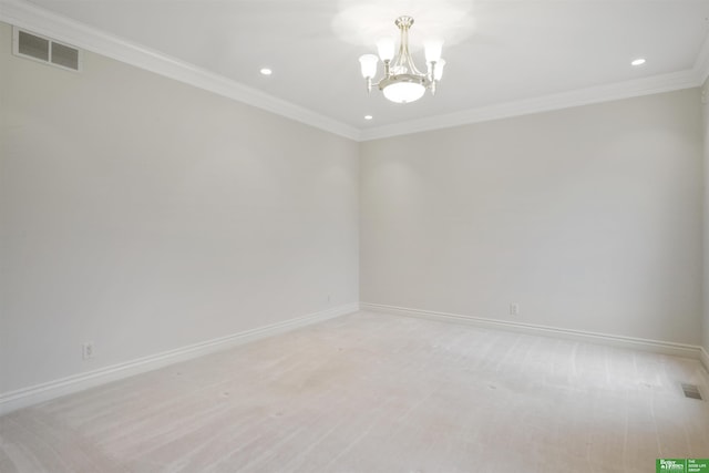 unfurnished room featuring ornamental molding and a notable chandelier