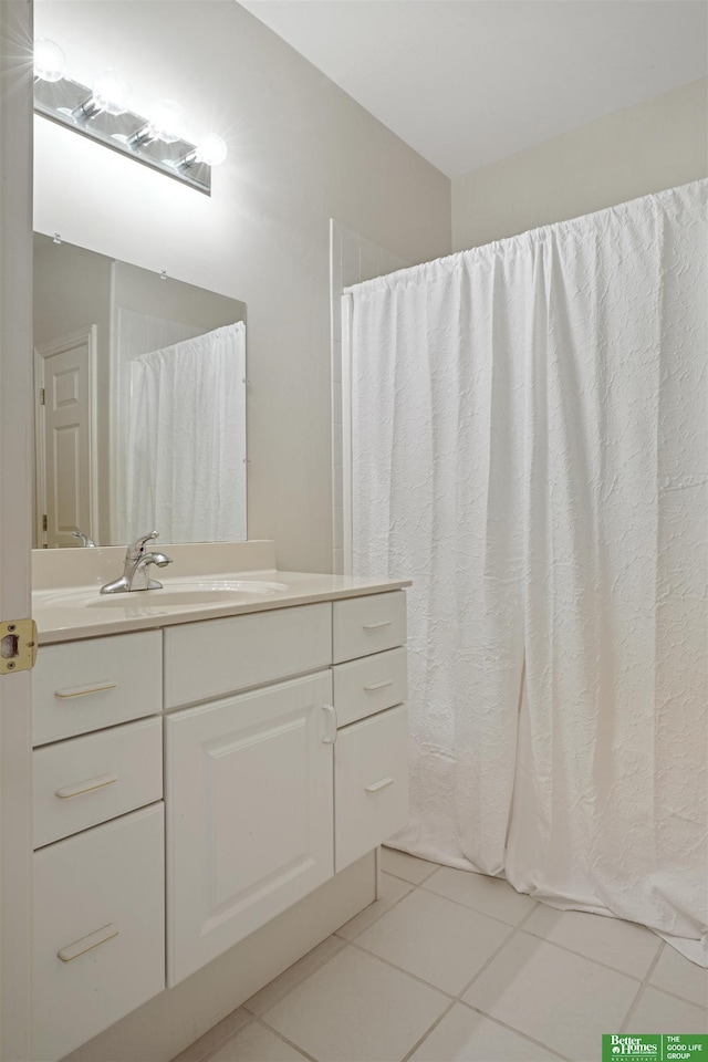 bathroom with tile patterned floors and vanity