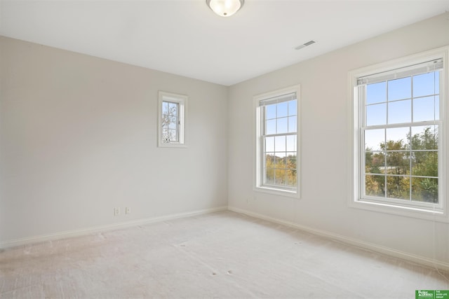 spare room with light colored carpet