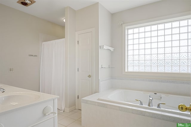 bathroom featuring tile patterned floors, vanity, separate shower and tub, and a wealth of natural light