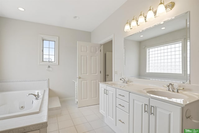 bathroom with vanity, tiled bath, and tile patterned floors